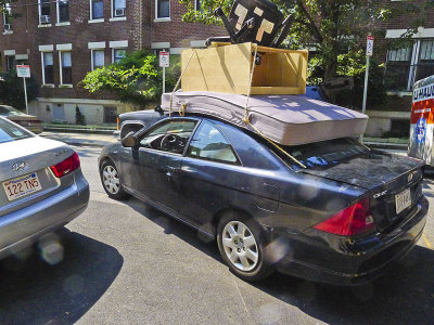 He is on his precarious way with the final roof load, yikes!