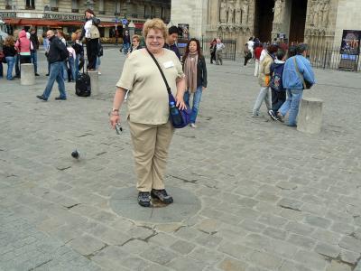 Ann on the good luck star. If you stand on it, you will come back to Paris one day.