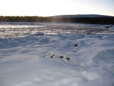 A very cold day, steam coming from the ice-cold water...