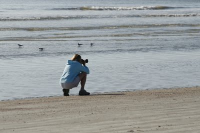 Nancy taking picures at the beach