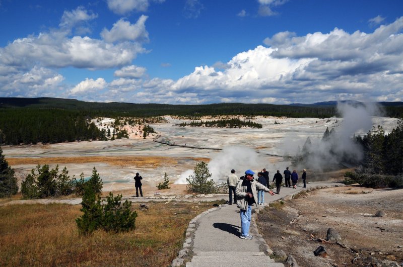 Yellowstone NP Norris Geyser Basin Charlie Points out small geyser.jpg