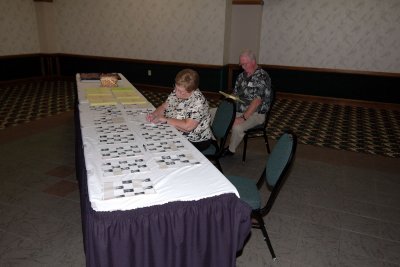DSC_0002 Carole Bowman Bard & her better half, Phil, staff the Check-In