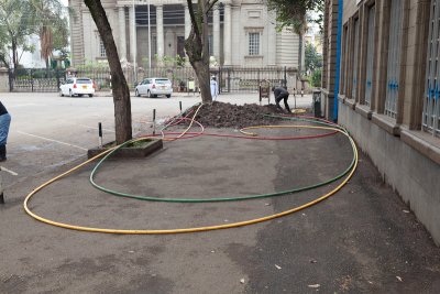 Street construction in central Nairobi - note the hoses in African unity colors