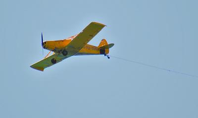Piper P-25 towing banner