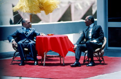 Sadat and Begin sitting next door to Red Sea Divers using our table and chairs