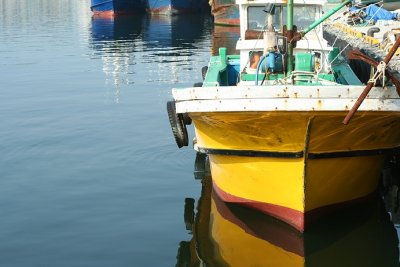 yellow boat in  harbor