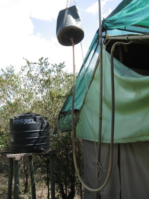 Tent camp shower behind the scenes