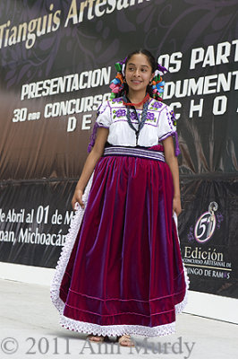 Girl wearing velvet apron