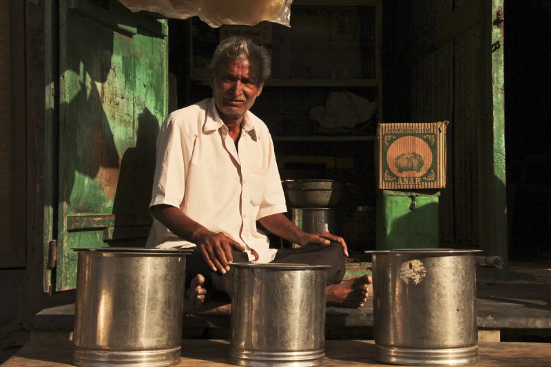 Patan man in shop.jpg