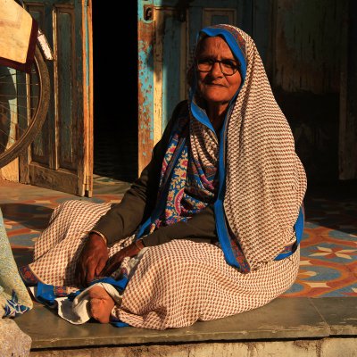 Patan woman sitting square.jpg