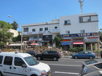 stores across the street during our walk in Haifa