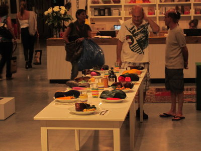 people contemplating shoes for dinner-housewares store in Tel Aviv