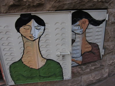 faces in repose painted on ventilation door