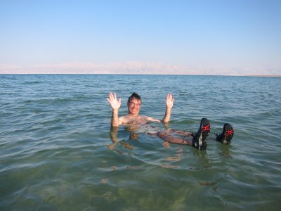 Rich floating-hands up-in the Dead Sea