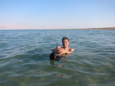 Rich sitting holding knee on the Dead Sea