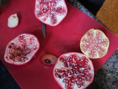 At Tami and Micha's-- red and white pomegranates-some already squeezed