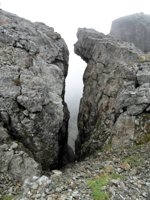 Narrow, very steep craig filled with treacherous scree.