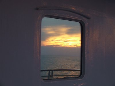 Sunset Reflection in a Stateroom Window