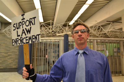  . . . I support law enforcement!  If you hack yourself . . .  you, too, can hold a sign just like this.