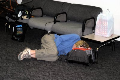 Laura takes a nap waiting for the last flight home thru SFO