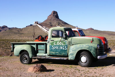 Old tow truck and pickup