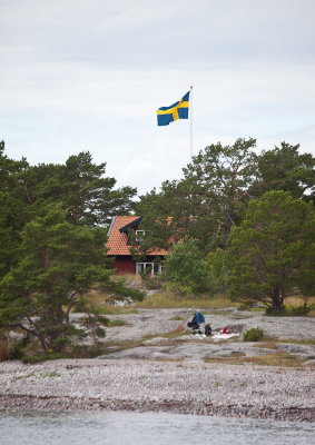 Red house and Swedish flag