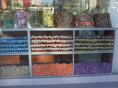 Candy shop in Adana.  The turban-shapes are a solid mass of nuts and jelly-rollup-like filling.