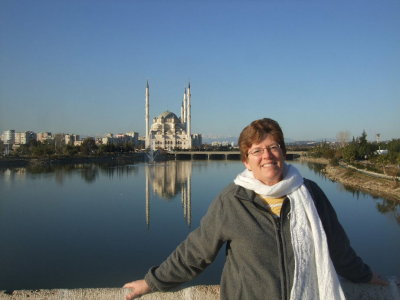Carol on the Roman Bridge in Adana.  Look closely to see snow-topped mountains between my head and the mosque.