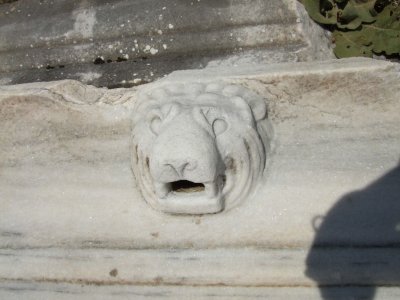 This is a water spout from the facade of a building.  As water drained from the rooftop, it flowed from the lion's mouth.