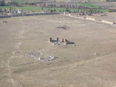 A view of the city below.  The ruins were probably a church or bath.