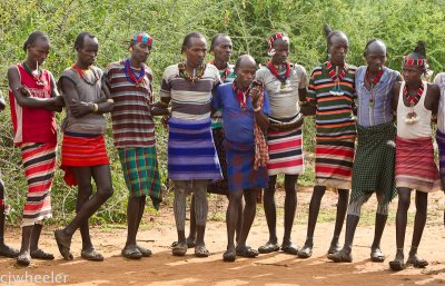 Some of the men. This tribe wore these short skirts.