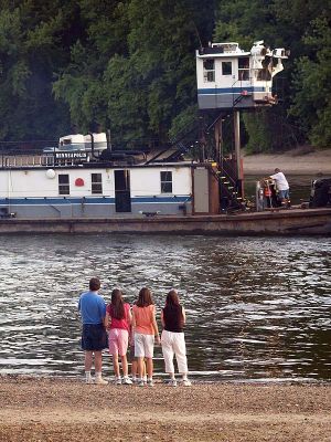 Family Watching a Barge on the Mississippi River