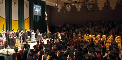 Faculty applauds the graduates