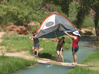 When transporting a tent across a river or creek, be sure to stop and wave