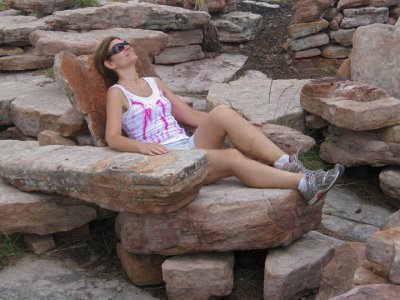 Donna resting in Fred Flinstone's easy chair