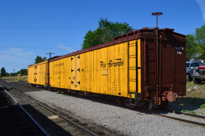 38 DRGW reefers from front with morning sun making the yellow paint glow