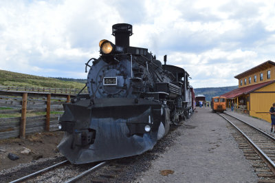 53 K36 484 waits to take its train west as the New Mexico is seen to the right