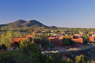 The Sun & Moon mountains, with suburban Santa Fe in the valley