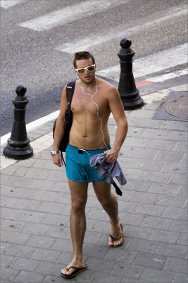 this tourist shows how hot and humid it is in Tel Aviv in August.