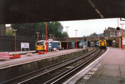 A Class 73 stands at the platform as a Class 431 arrives at Clapham Junction - 20 Oct 1991.