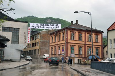 Entering Višegrad beneath a banner for a folklore festival