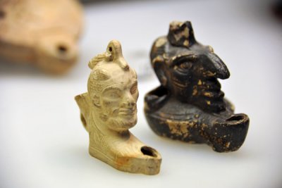 Oil lamps with caricature heads