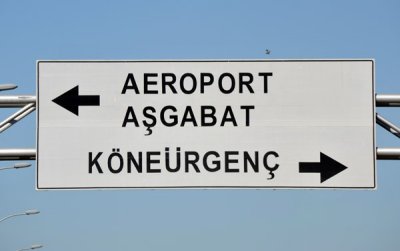 Sign for Dashoguz Airport and the roads to Ashgabat and Konye-Urgench