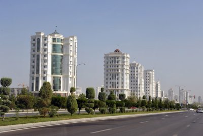 Another row of new apartment buildings along a wide boulevard