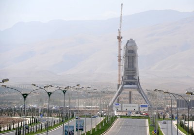 The Arch of Neutrality under reconstruction in a new location on the far edge of Ashgabat