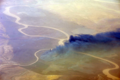 Senegal-Mauritania border - fire burning along the Senegal River near Tiguet