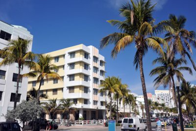 A grassy park with a bike trail separates Ocean Drive from the beach