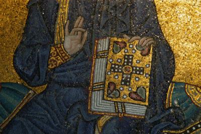 Detail of Christ's hand and Bible