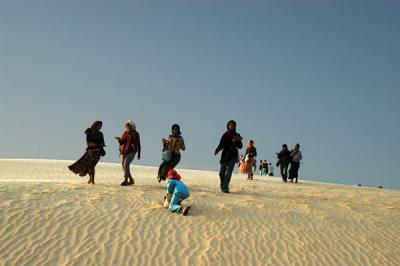 As we arrive at the largest dune, were accosted by women selling trinkets