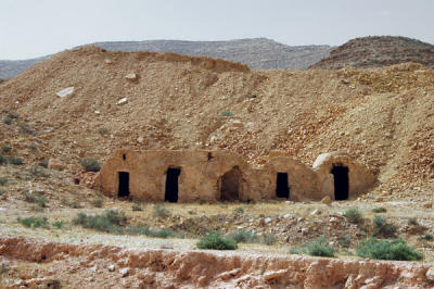 Homes built into the hillside off the C113 SW of Medenine